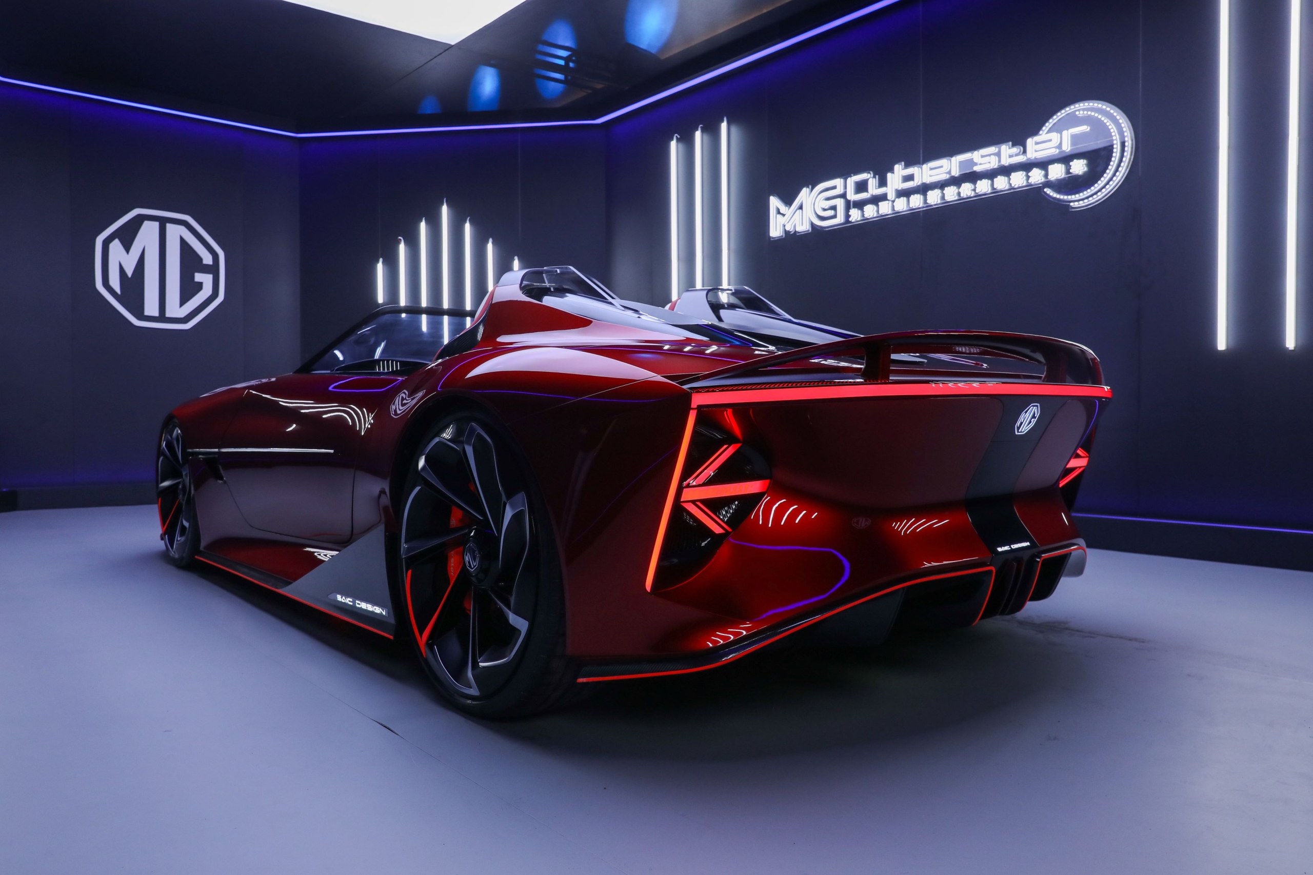 MG Cyberster electric roadster concept car rear view with illuminated tail lights and futuristic design